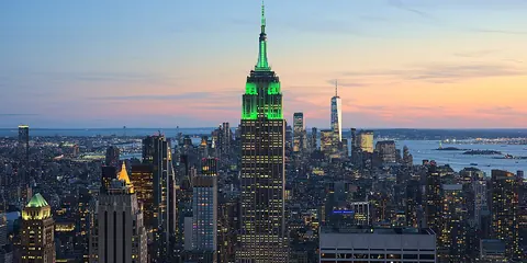 Empire State Building and Manhattan skyline at sunset